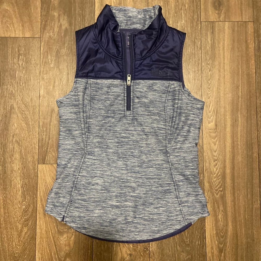 The North Face blue and grey zip puffer vest
